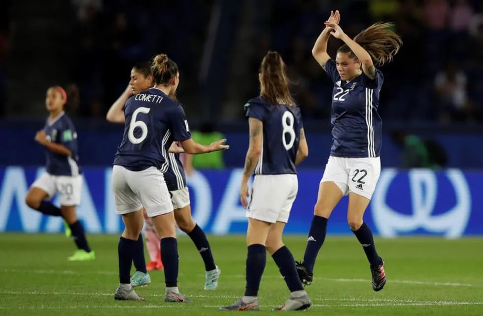 Argentina's Milagros Menendez, right, celebrates after scoring her side's first goal during the Women's World Cup Group D soccer match between Scotland and Argentina at Parc des Princes in Paris, France, Wednesday, June 19, 2019. The match ended in a 3-3 draw. (AP Photo/Alessandra Tarantino)