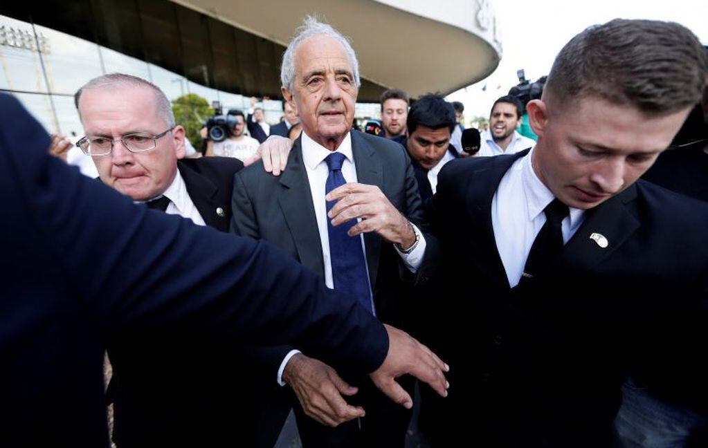 River Plate soccer club President Rodolfo D'Onofrio leaves a hotel before meeting with Boca Junior soccer club President Daniel Angelici and CONMEBOL President Alejandro Dominguez at CONMEBOL headquarters in Luque, Paraguay, Tuesday, Nov. 27, 2018. Fearing more fan violence, organizers have decided that the postponed Copa Libertadores final between the two Argentine rivals should be played in another country. (AP Photo/Jorge Saenz)