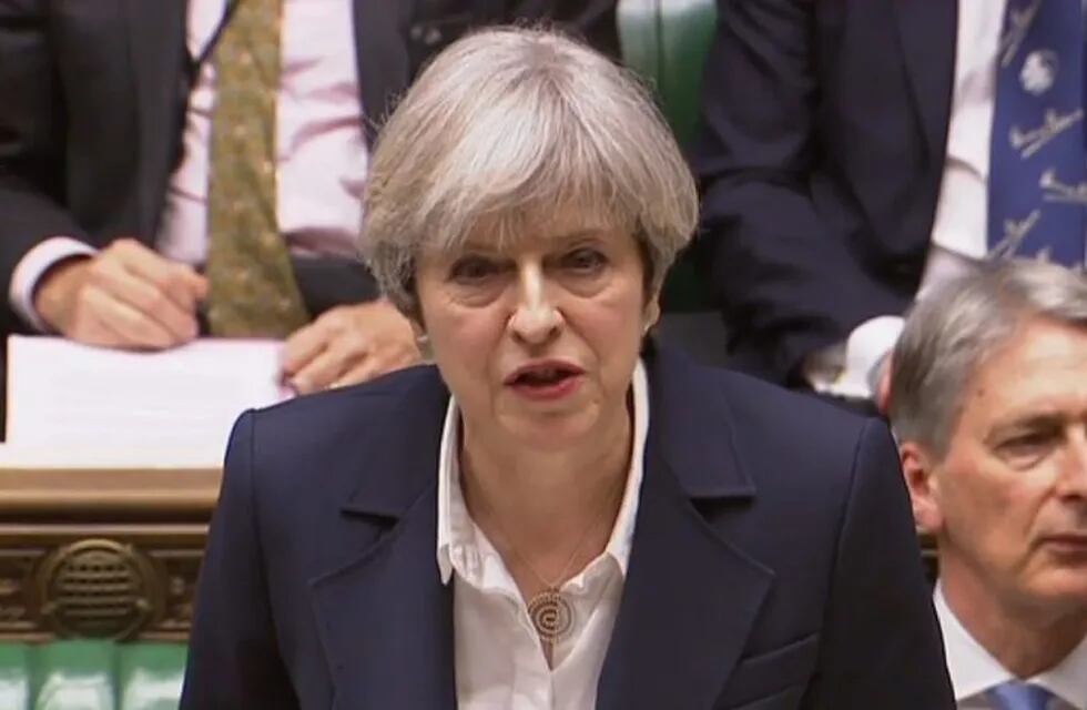 A still image taken from footage broadcast by the UK Parliamentary Recording Unit (PRU) on March 29, 2017 shows British Prime Minister Theresa May at the dispatch box making a statement in the House of Commons in London after the letter invoking the provi