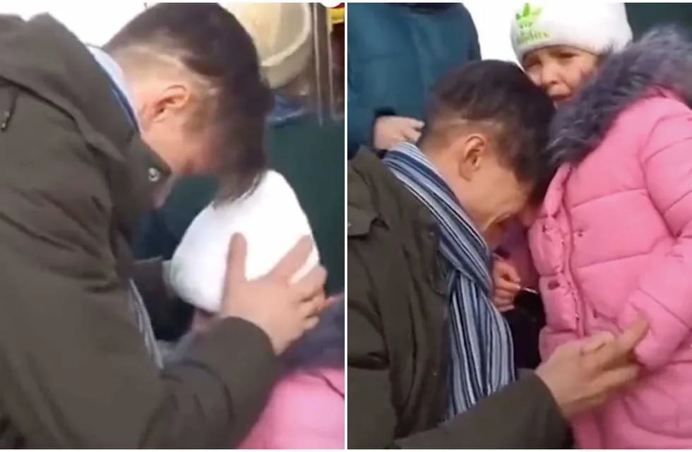 Ucrania. Un padre se despide de su hija que va a ser evacuada.