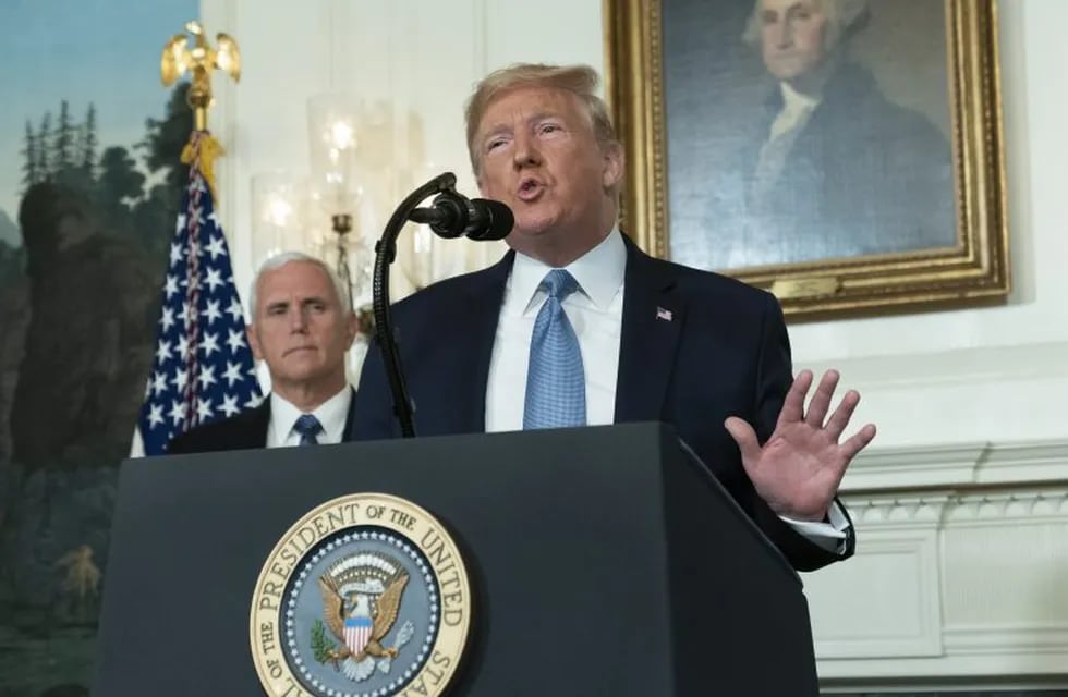 August 5, 2019 - Washington, DC, United States: United States President Donald J. Trump makes a statement at the White House in Washington, DC in response to two separate shooting incidents, August 5, 2019. United States Vice President Mike Pence listens. (Chris Kleponis / CNP / Polaris)