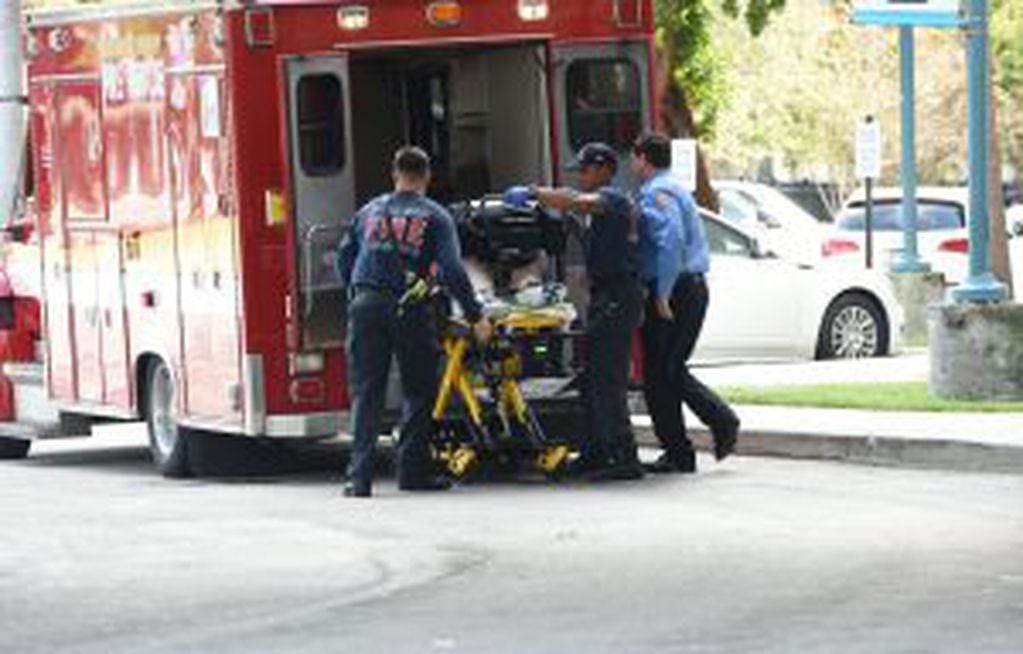 A shooting victim is unloaded from an emergency vehicle and taken into Broward Health Trauma Center in Fort Lauderdale, Fla., Friday, Jan. 6, 2017.  Authorities said multiple people have died after a lone suspect opened fire at the Ft. Lauderdale, Florida