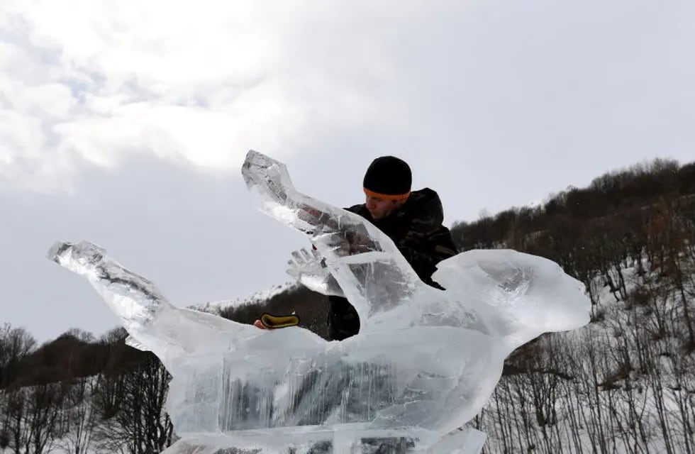 Russian ice sculptor Andrey Molokov works on his ice sculpture called \