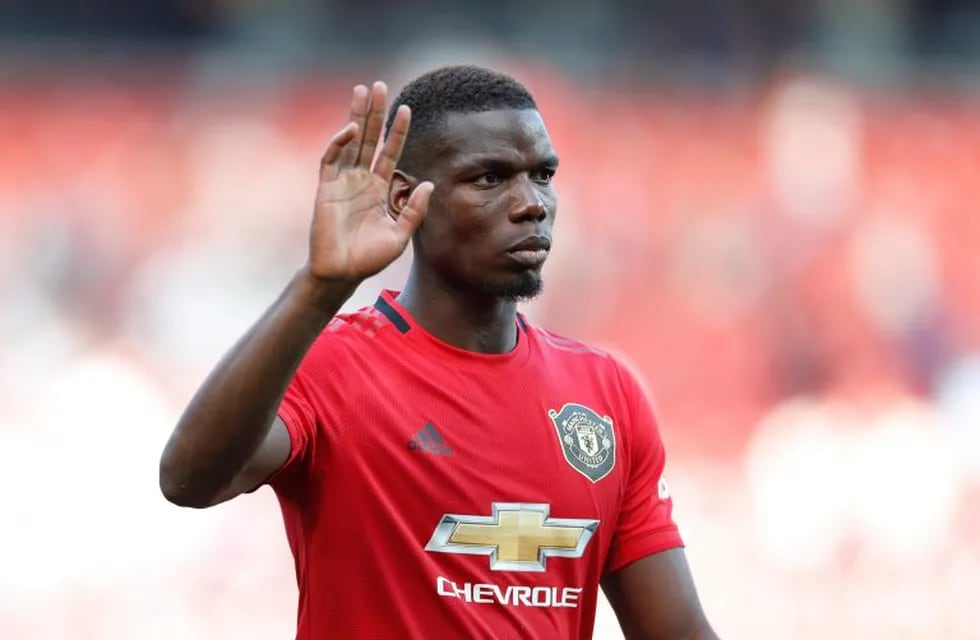 Manchester United's Paul Pogba leaves the pitch at the end of the English Premier League soccer match between Manchester United and Crystal Palace at Old Trafford in Manchester, England Saturday, Aug, 24, 2019. (AP Photo/Alastair Grant)
