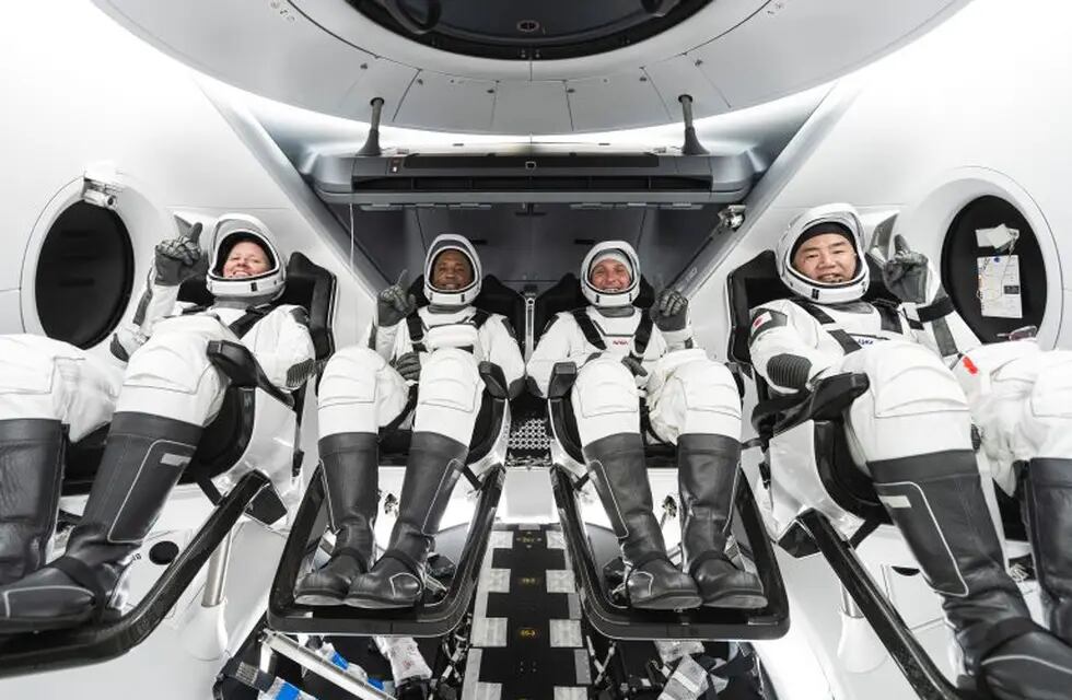 This undated photo made available by SpaceX in September 2020 shows, from left, NASA astronauts Shannon Walker, Victor Glover, commander Mike Hopkins and Japan Aerospace Exploration Agency astronaut Soichi Noguchi inside SpaceX's Crew Dragon spacecraft. The four are scheduled to be SpaceX’s second crew launch in mid-November 2020. (SpaceX via AP)