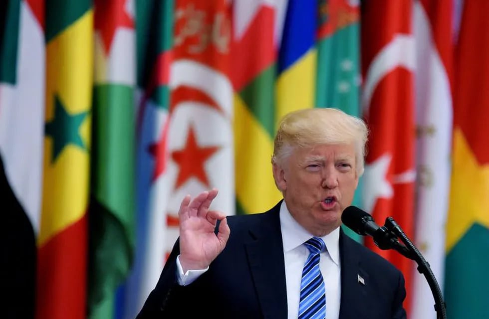 (FILES) This file photo taken on May 21, 2017 shows US President Donald Trump speaking during the Arab Islamic American Summit at the King Abdulaziz Conference Center in Riyadh.\nUS President Donald Trump on June 6, 2017 linked Arab moves to isolate Qatar to his recent Middle East trip, showing little sympathy for the plight of the Gulf emirate despite its role as a hub for US military operations in the region. \