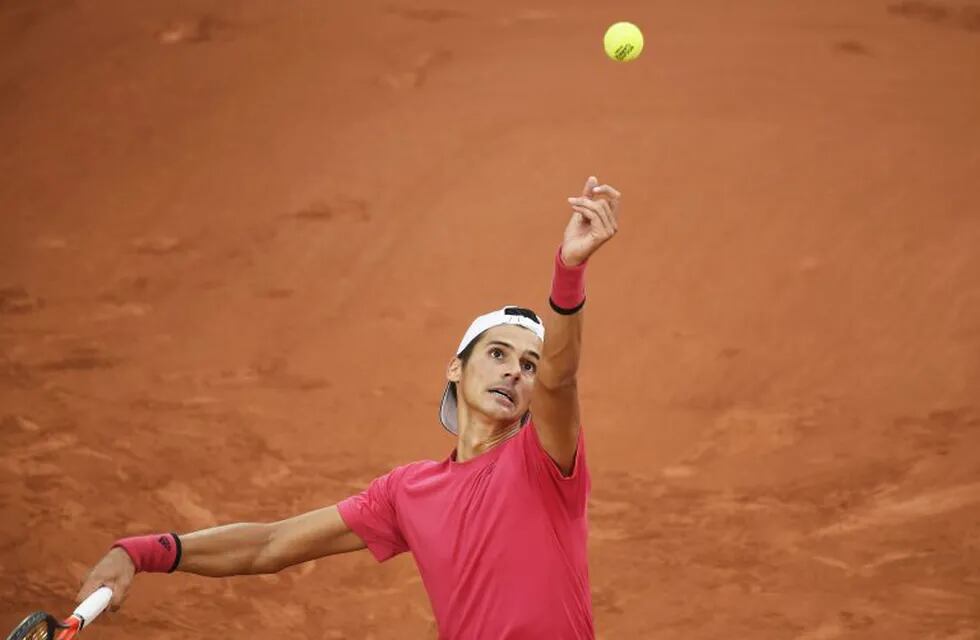 Paris (France), 30/09/2020.- Federico Coria of Argentina serves during his second round match against Benoit Paire of France at the French Open tennis tournament at Roland Garros in Paris, France, 30 September 2020. (Tenis, Abierto, Francia) EFE/EPA/JULIEN DE ROSA
