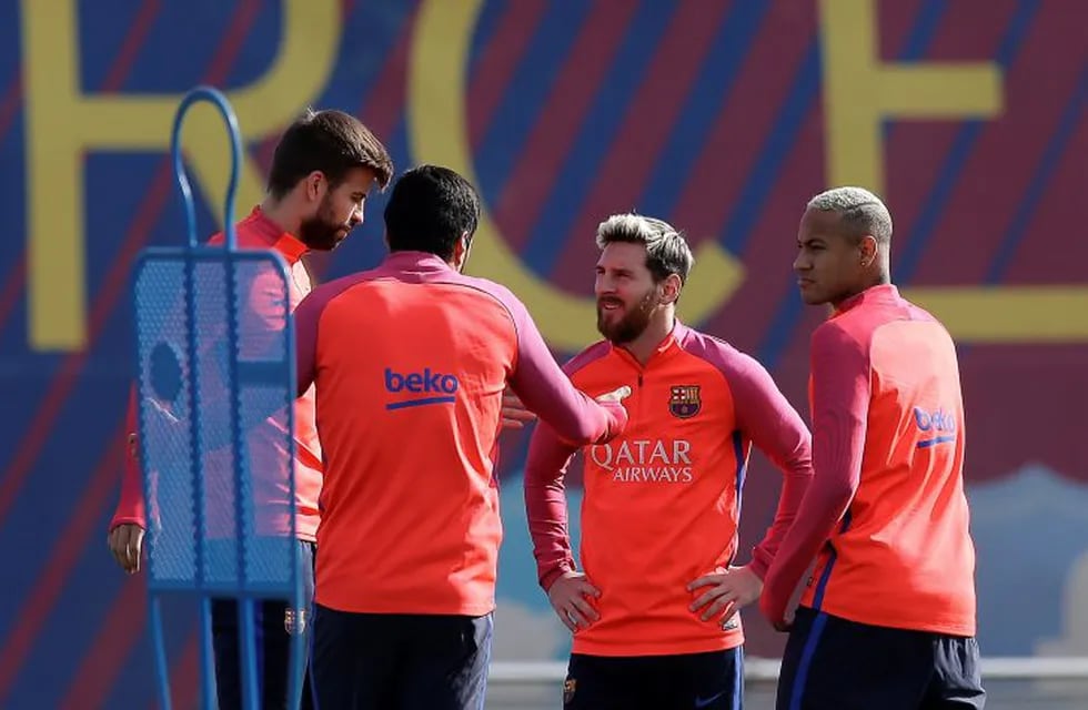 From left to right: FC Barcelona's Gerard Pique, Luis Suarez, Lionel Messi and Neymar attend a training session at the Sports Center FC Barcelona Joan Gamper in Sant Joan Despi, Spain, Friday, Oct. 14, 2016. (AP Photo/Manu Fernandez)