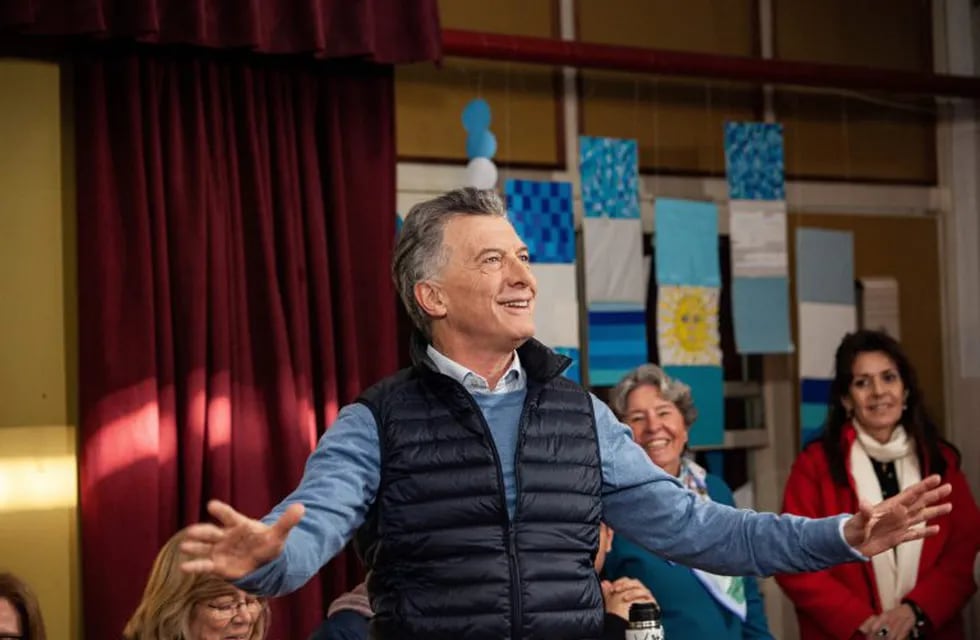 Mauricio Macri, Argentina's president, waves while arriving to cast a ballot during primary elections in the Palermo neighborhood of Buenos Aires, Argentina, on Sunday, Aug. 11, 2019. Argentines head to the polls Sunday in a primary vote that will be the best gauge yet of Macri's chances of winning a second term in this year's election. Photographer: Erica Canepa/Bloomberg