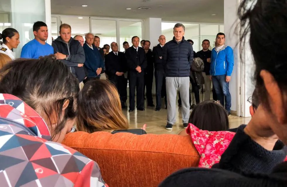 In this picture released by Argentina's presidential press office, Argentina's President Mauricio Macri, front right, listens to relatives of crew members from a missing submarine at the Navel base in Mar del Plata, Argentina, Monday, Nov. 20, 2017. Authorities last had contact with submarine ARA San Juan on Wednesday as it was on a voyage from the extreme southern port of Ushuaia to the city of Mar del Plata. (Argentina Presidency via AP)