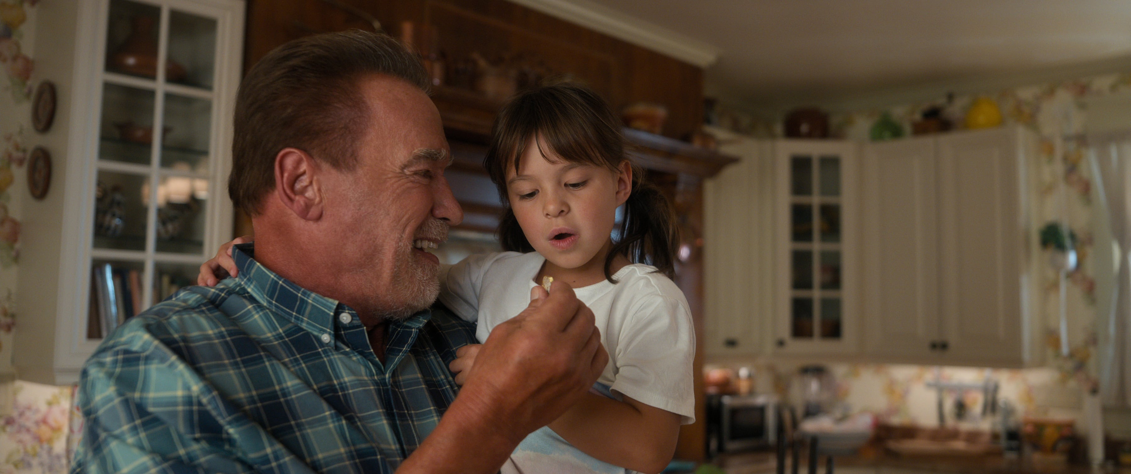 Fubar. (L to R) Arnold Schwarzenegger as Luke Brunner, Rachel Lynch as Romi in episode 101 of Fubar. Cr. Courtesy of Netflix © 2023