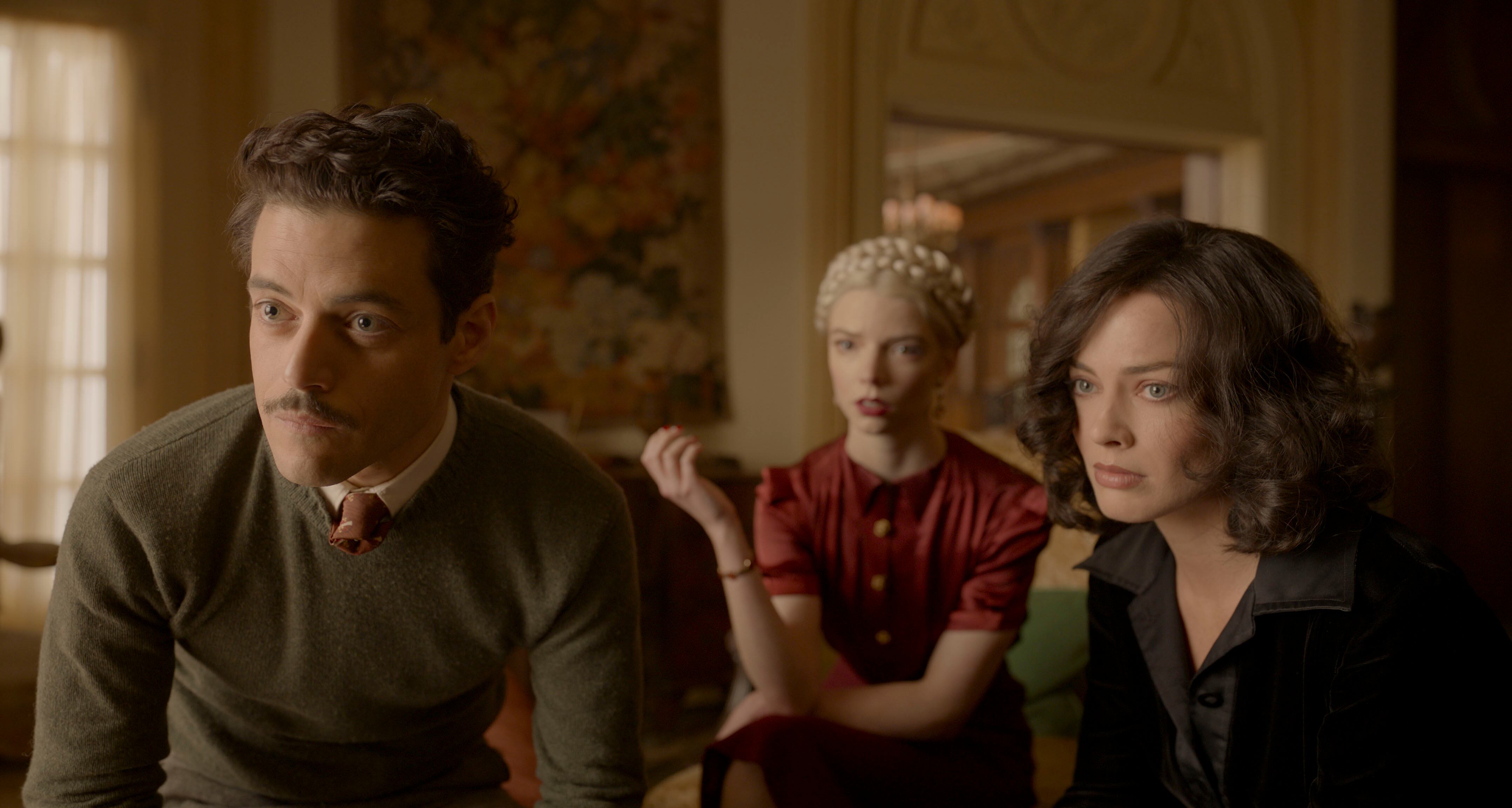 (L-R): Rami Malek, Anya Taylor-Joy, and Margot Robbie in 20th Century Studios' AMSTERDAM. Photo courtesy of 20th Century Studios. © 2022 20th Century Studios. All Rights Reserved.