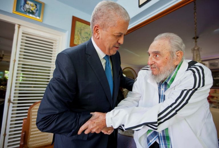 Cuba's former leader Fidel Castro, right, shakes hands with Algeria's Prime Minister Abdelmalek Sellal, left, in Havana, Cuba, Thursday, Oct. 13, 2016. Abdelmalek Sellal is on a two-day official visit to Cuba. (AP Photo/Alex Castro)