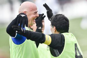 FIFA president Gianni Infantino (L) and Argentinian football legend Diego Armando Maradona celebrate after Maradona scored a penalty during a FIFA Football Legends football game ahead of The Best FIFA Football Awards 2016 on January 9, 2017 at the FIFA's 