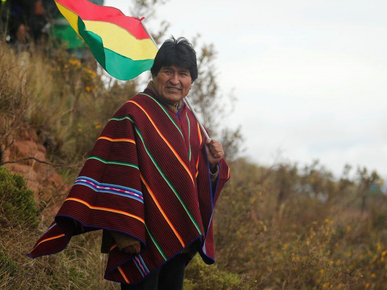 Bolivia's President Evo Morales waits for the pass of competitors of the 2018 Dakar Rally in Guaqui, Bolivia, Thursday, Jan. 11, 2018. (Andres Stapff/Pool Photo via AP)