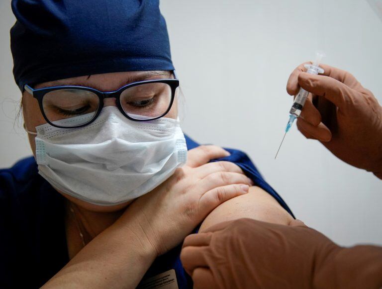 FILE PHOTO: A medic of the regional hospital receives  Russia's "Sputnik-V" vaccine shot against the coronavirus disease (COVID-19) in Tver, Russia October 12, 2020.  REUTERS/Tatyana Makeyeva/File Photo