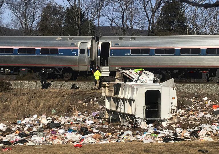 Emergency personnel work at the scene of a train crash involving a garbage truck in Crozet, Va., on Wednesday, Jan. 31, 2018. An Amtrak passenger train carrying dozens of GOP lawmakers to a Republican retreat in West Virginia struck a garbage truck south of Charlottesville, Va. No lawmakers were believed injured.   (Zack Wajsgrasu/The Daily Progress via AP)