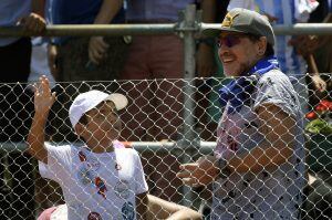 Argentina former footballer Diego Maradona (R) gestures next to his grandson Benjamin Aguero (son of Gininna Maradona and footballer Sergio Aguero) after Italy's tennis player Paolo Lorenzi defeated by 6-3, 6-3, 6-3, Argentina's Guido Pella in their 2017 