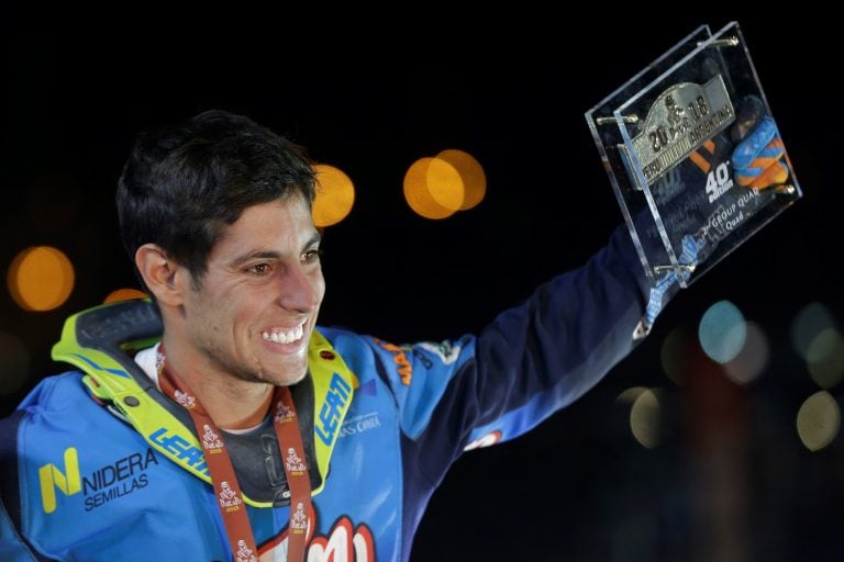 Yamaha quad rider Nicolas Cavigliasso, of Argentina, celebrates finishing second at the podium for the 2018 Dakar Rally in Cordoba, Argentina, Saturday, Jan. 20, 2018. (AP Photo/Ricardo Mazalan)