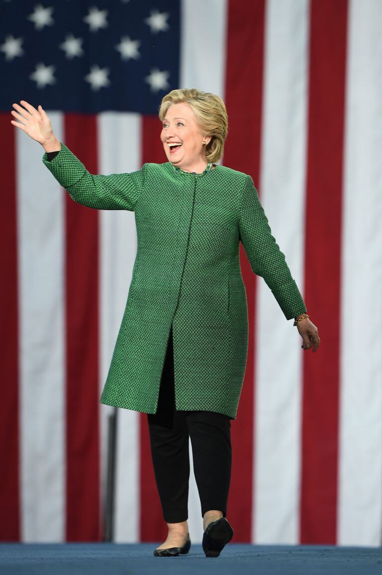 TOPSHOT - Democratic presidential nominee Hillary Clinton arrives on stage for a rally at the University of North Carolina at Charlotte, October 23, 2016, in Charlotte, North Carolina. / AFP PHOTO / Robyn BECK