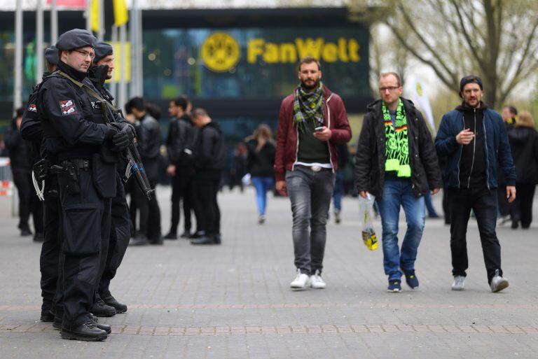 Football Soccer - Borussia Dortmund v AS Monaco - UEFA Champions League Quarter Final First Leg - Signal Iduna Park, Dortmund, Germany - 12/4/17 Police officers outside the stadium with fans before the match Reuters / Kai Pfaffenbach Livepic