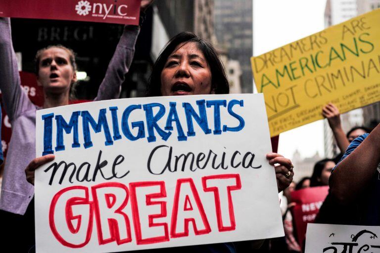 (FILES) This file photo taken on October 05, 2017 shows protesters during a demonstration against US President Donald Trump during a rally in support of the Deferred Action for Childhood Arrivals (DACA), also known as Dream Act, near the Trump Tower in New York.
Over 100 major US companies joined forces to urge Congress to protect immigrants brought to the country as children, signing a letter published in full-page ads in major newspapers on January 11, 2018. The companies called for immediate action to help workers who will lose the protection of the Deferred Action for Childhood Arrivals (DACA) program in March. Chief executives of Google, Facebook, Amazon and Apple -- together known as GAFA -- were joined by those from IBM, Microsoft, Coca-Cola, General Motors, AT&T, Marriott, Hilton and dozens of others signing the letter calling for protection for the "Dreamers."
 / AFP PHOTO / Jewel SAMAD