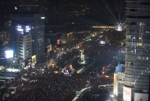 Protesters stage a candle light vigil calling for impeached President Park Geun-hye to step down in Seoul, South Korea, Saturday, Dec. 31, 2016. Even on New Year's Eve, large crowds of South Koreans gathered to join another rally demanding the ouster of i