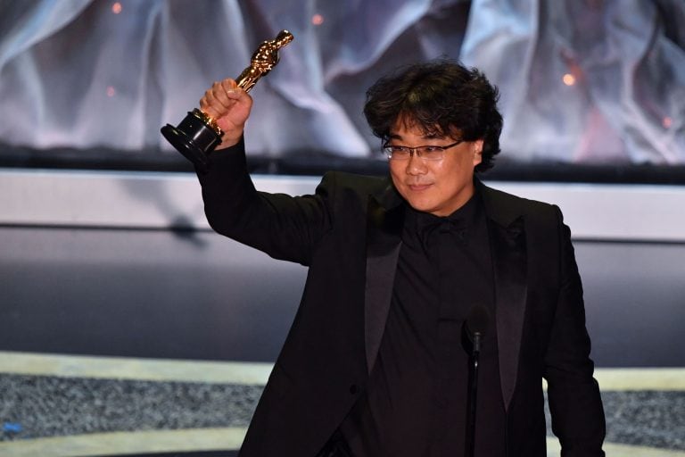 South Korean director Bong Joon-ho accepts the award for Best International Feature Film for "Parasite" during the 92nd Oscars at the Dolby Theatre in Hollywood, California on February 9, 2020. (Photo by Mark RALSTON / AFP)