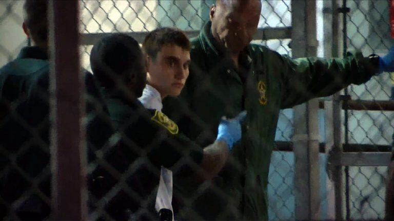 This video screen grab image shows shooting suspect Nikolas Cruz on February 15, 2018 at Broward County Jail in Ft. Lauderdale, Florida.
The heavily armed teenager who gunned down students and adults at a Florida high school was charged Thursday with 17 counts of premeditated murder, court documents showed.
Nikolas Cruz, 19, killed fifteen people in a hail of gunfire at Marjory Stoneman Douglas High School in Parkland, Florida. Two others died of their wounds later in hospital, the sheriff's office said.
 / AFP PHOTO / AFP TV / Miguel GUTTIEREZ