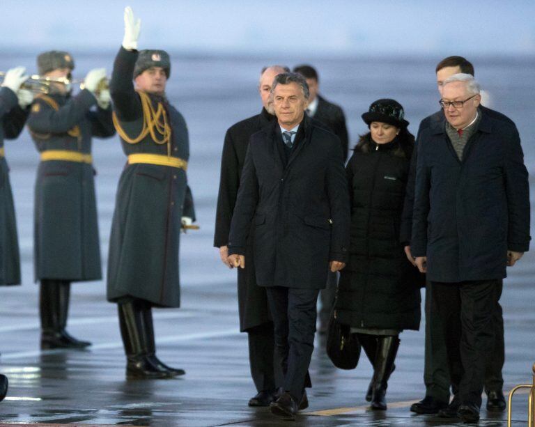 Argentina's President Mauricio Macri, centre, arrives at the Vnukovo government airport for official visit to Russia in Moscow, Russia, Monday, Jan. 22, 2018. (AP Photo/Pavel Golovkin)