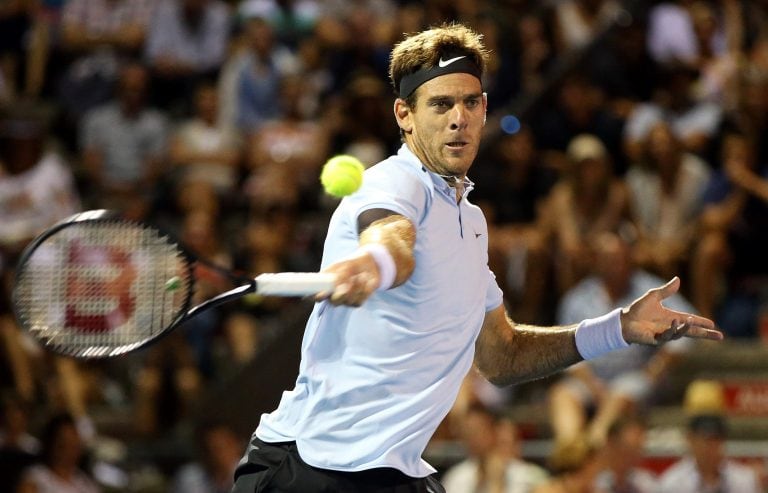 Juan Martin Del Potro of Argentina hits a return against David Ferrer of Spain during their men's singles semi-final match at the ATP Auckland Classic tennis tournament in Auckland on January 12, 2018. / AFP PHOTO / MICHAEL BRADLEY