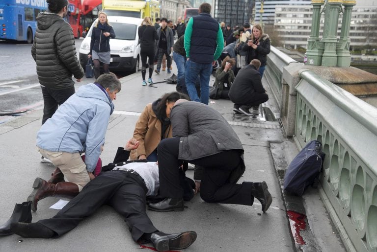 Injured people are assisted after an incident on Westminster Bridge in London, March 22, 2017.  REUTERS/Toby Melville