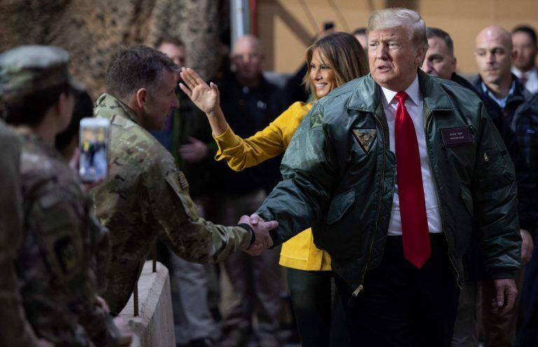 Donald y Melania Trump en la base Al Asad, en diciembre de 2018. (Foto: Saúl Loeb/AFP)