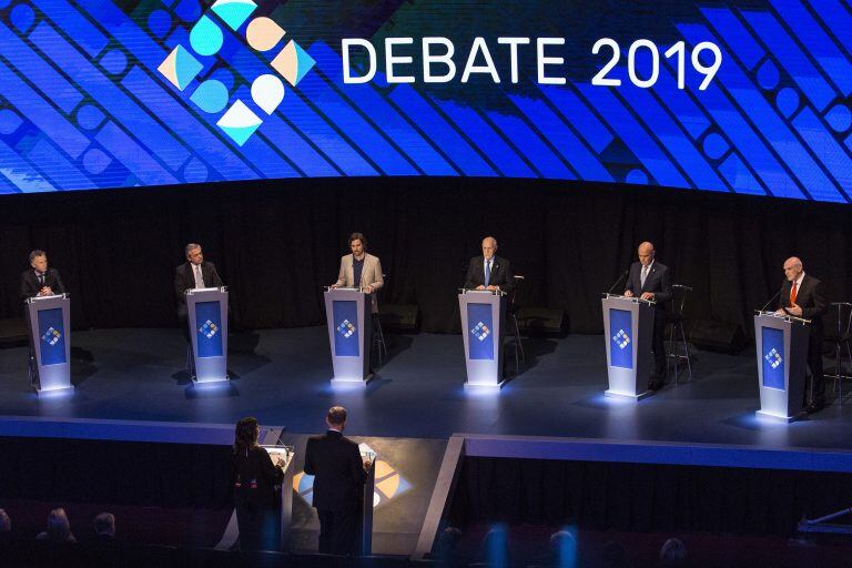 Mauricio Macri, Argentina's president, from left, Alberto Fernandez, presidential candidate for Frente de Todos party, Nicolas del Cano, presidential candidate for FIT party, Roberto Lavagna, presidential candidate for Consenso Federal Party, Juan Jose Gomez Centurion, presidential candidate for Frente Nos party, and Jose Luis Espert, presidential candidate for Unite Party, attend a presidential candidate debate in Buenos Aires, Argentina, on Sunday, Oct. 20, 2019. Argentines will head to the polls on Oct. 27 amid a dour economic backdrop of galloping consumer prices and activity contradiction. Photographer: Sarah Pabst/Bloomberg