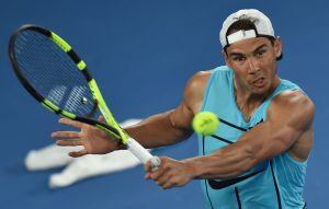 Rafael Nadal of Spain makes a return during a practice session ahead of the Australian Open tennis tournament in Melbourne on January 13, 2017.  / AFP PHOTO / PAUL CROCK / --IMAGE RESTRICTED TO EDITORIAL USE - STRICTLY NO COMMERCIAL USE--