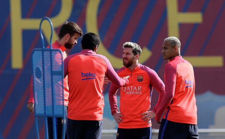 From left to right: FC Barcelona's Gerard Pique, Luis Suarez, Lionel Messi and Neymar attend a training session at the Sports Center FC Barcelona Joan Gamper in Sant Joan Despi, Spain, Friday, Oct. 14, 2016. (AP Photo/Manu Fernandez)