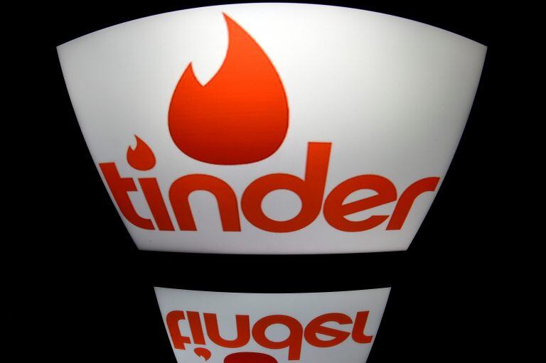 Tinder (LIONEL BONAVENTURE / AFP)