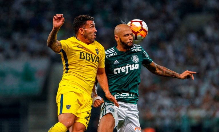 Felipe Melo y Carlos Tevez. (Foto: AFP PHOTO / Miguel SCHINCARIOL)