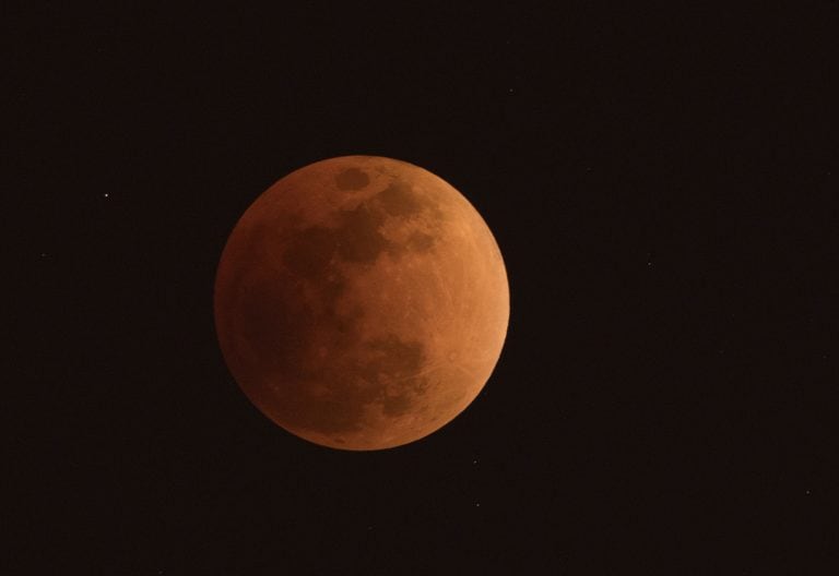 The moon is seen during a lunar eclipse, referred to as the "super blue blood moon", in Beijing on January 31, 2018.
Skywatchers were hoping for a rare lunar eclipse that combines three unusual events -- a blue moon, a super moon and a total eclipse -- which was to make for a large crimson moon viewable in many corners of the globe. / AFP PHOTO / NICOLAS ASFOURI