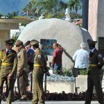 Workers fix the plaque with his name on Cuban leader Fidel Castro's tomb at the Santa Ifigenia cemetery Santiago de Cuba on December 4, 2016.
Fidel Castro's ashes were buried alongside national heroes in the cradle of his revolution on Sunday, as Cuba ope