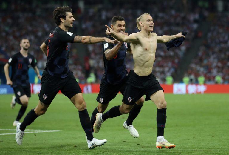 Soccer Football - World Cup - Quarter Final - Russia vs Croatia - Fisht Stadium, Sochi, Russia - July 7, 2018  Croatia's Domagoj Vida celebrates their second goal with Vedran Corluka and Dejan Lovren   REUTERS/Carl Recine