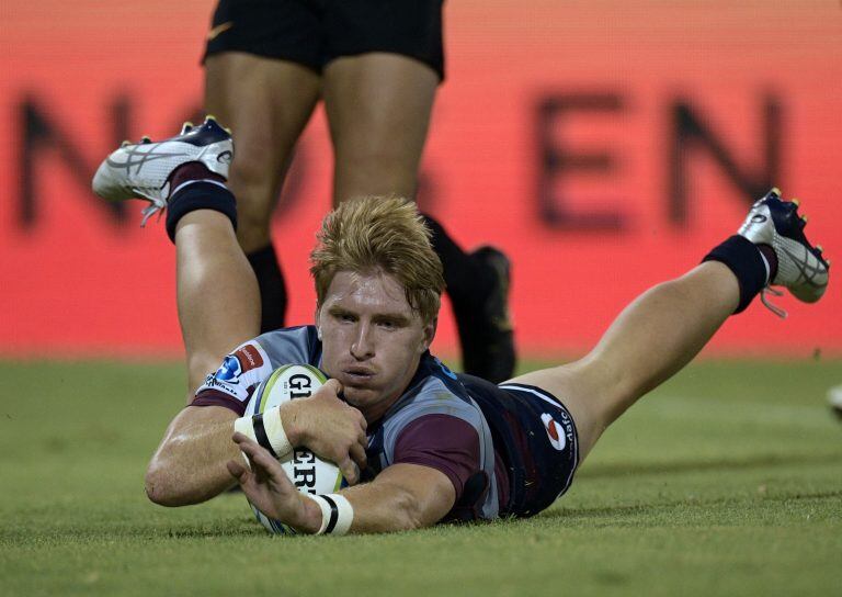 Tate McDermott marca un try para los Reds (Foto: JUAN MABROMATA/AFP)