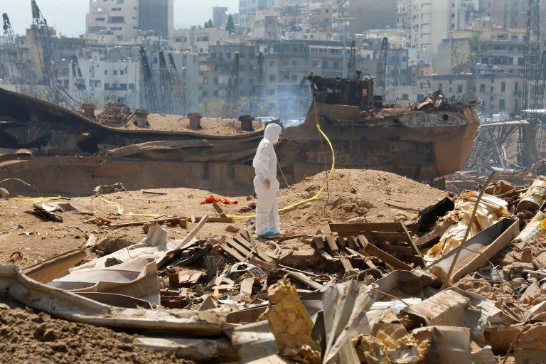 A forensic inspector walks on rubble at the site of Tuesday's blast, at Beirut's port area, Lebanon, August 7, 2020. REUTERS/Mohamed Azakir