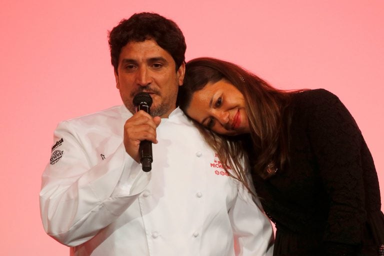 Newly awarded three-star Michelin Chef Mauro Colagreco, for his restaurant Mirazur in Menton, reacts as his wife listens on stage during the Michelin Guide 2019 award ceremony in Paris, France, January 21, 2019.  REUTERS/Philippe Wojazer