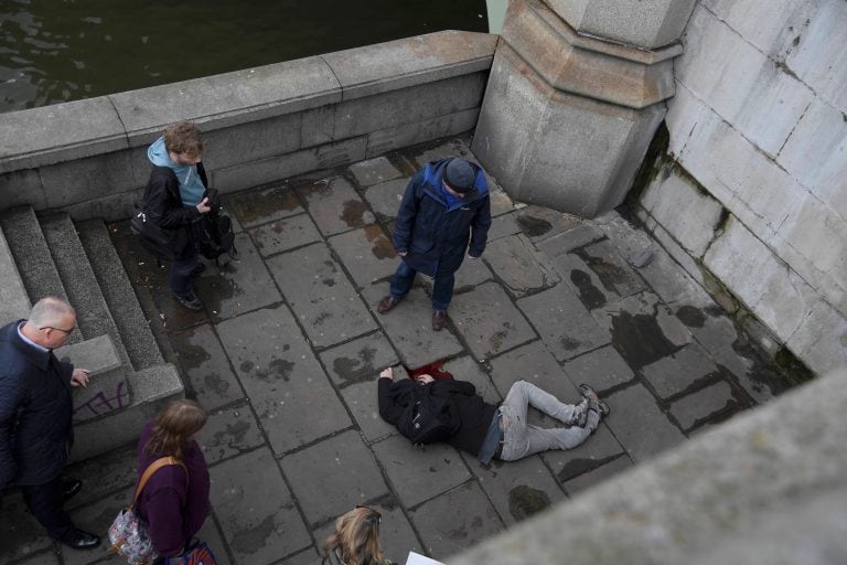 A man lies injured after a shottingt incident on Westminster Bridge in London, March 22, 2017.  REUTERS/Toby Melville