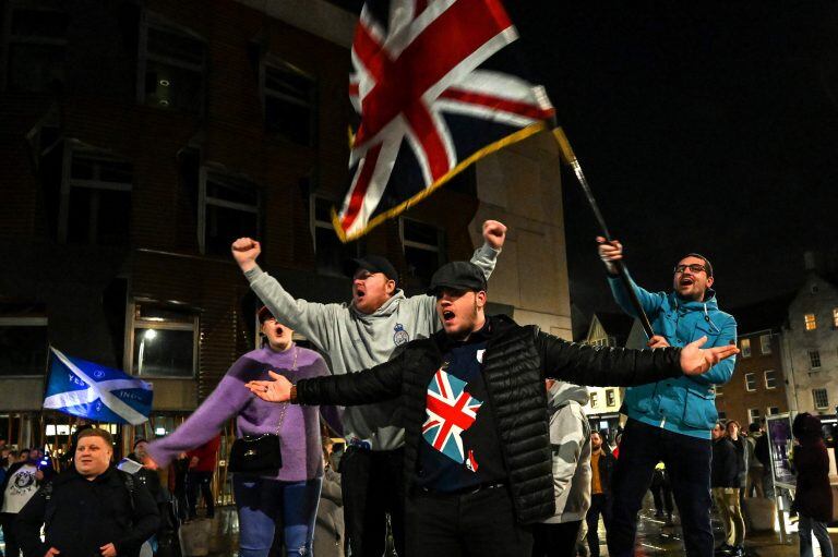 Protesters hold placards and wave flags during a protest by pro-Brexit activists in Edinburgh on January 31, 2020.
Edinburgh, Scotland 31 January 2020. - Britain on January 31 ends almost half a century of integration with its closest neighbours and leaves the European Union, starting a new -- but still uncertain -- chapter in its long history. (Photo by Andy Buchanan / AFP)