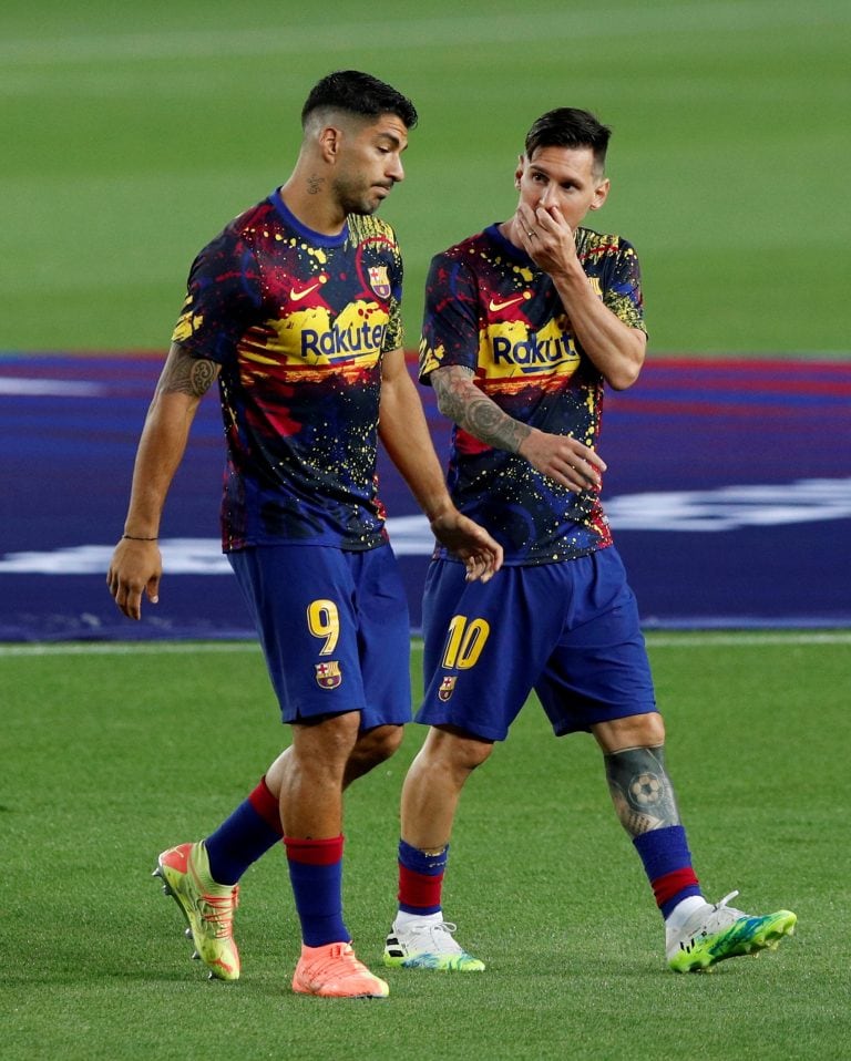 FILE PHOTO: Soccer Football - La Liga Santander - FC Barcelona v Atletico Madrid - Camp Nou, Barcelona, Spain - June 30, 2020   Barcelona's Lionel Messi and Luis Suarez during the warm up before the match, as play resumes behind closed doors following the outbreak of the coronavirus disease (COVID-19)   REUTERS/Albert Gea/File Photo