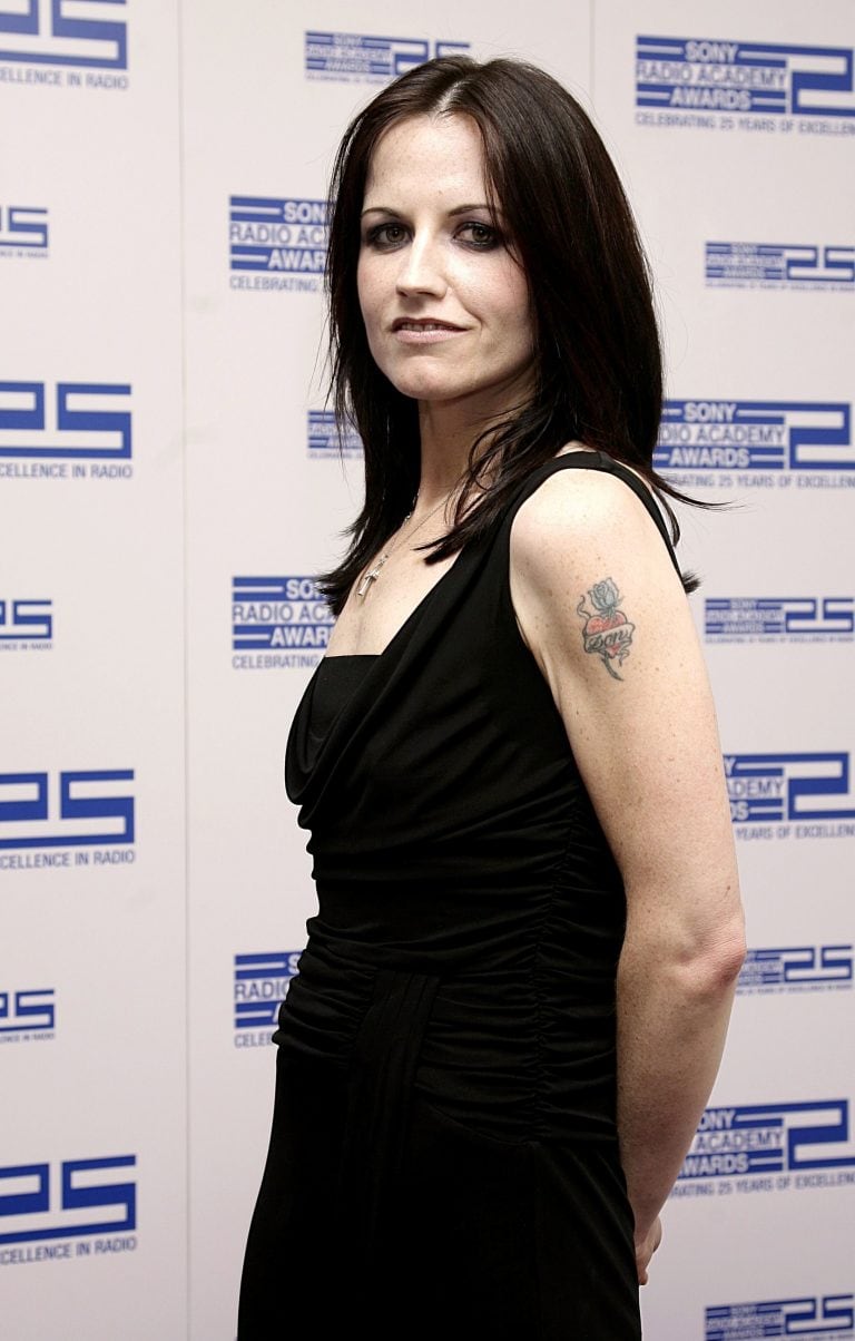 FILE - In this April 30, 2004 file photo, singer Dolores O'Riordan poses for photographers at the Sony Radio Academy Awards 2007, in London. Dolores O'Riordan, lead singer of Irish band The Cranberries, has died. She was 46, it was reported Monday, Jan. 15, 2018. (Yui Mok/PA via AP, File)