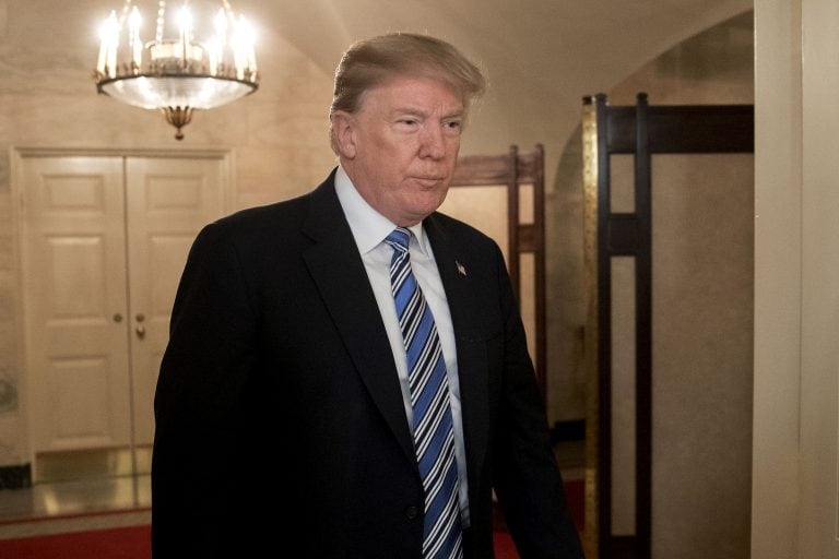 U.S. President Donald Trump arrives to a press conference about the Parkland, Florida high school shooting in the Diplomatic Room of the White House in Washington, D.C., U.S., on Thursday, Feb. 15, 2018. An orphaned 19-year-old with a troubled past and his own AR-15 rifle was charged with 17 counts of premeditated murder this morning following the deadliest school shooting in the U.S. in five years that occurred yesterday. Photographer: Andrew Harrer/Bloomberg