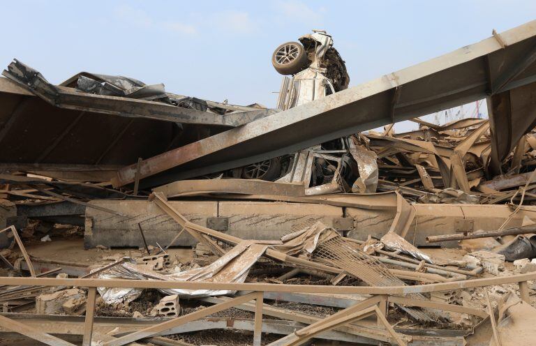 A damaged car and rubble are seen at the site of Tuesday's blast, at Beirut's port area, Lebanon, August 7, 2020. REUTERS/Mohamed Azakir